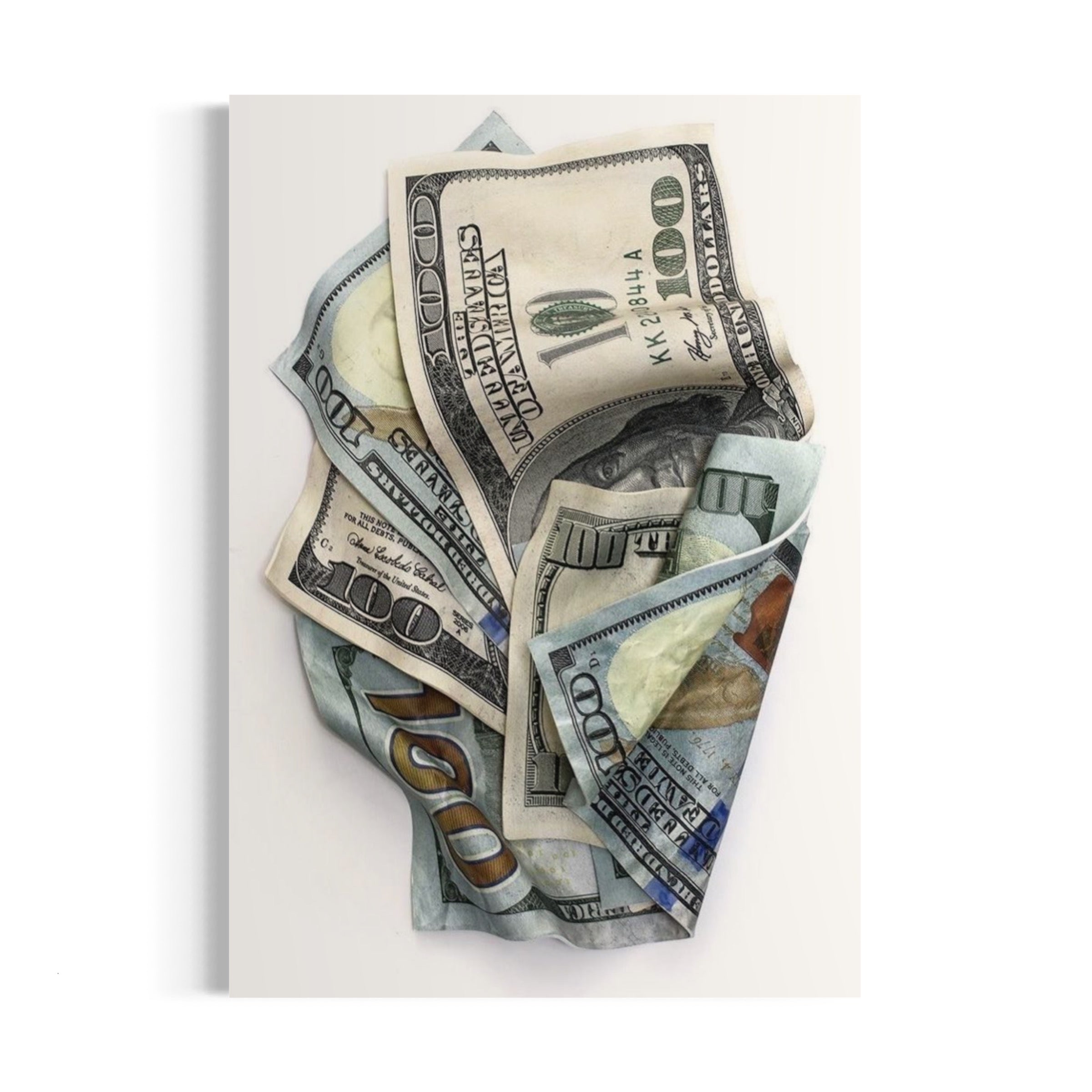 a pile of money sitting on top of a white table