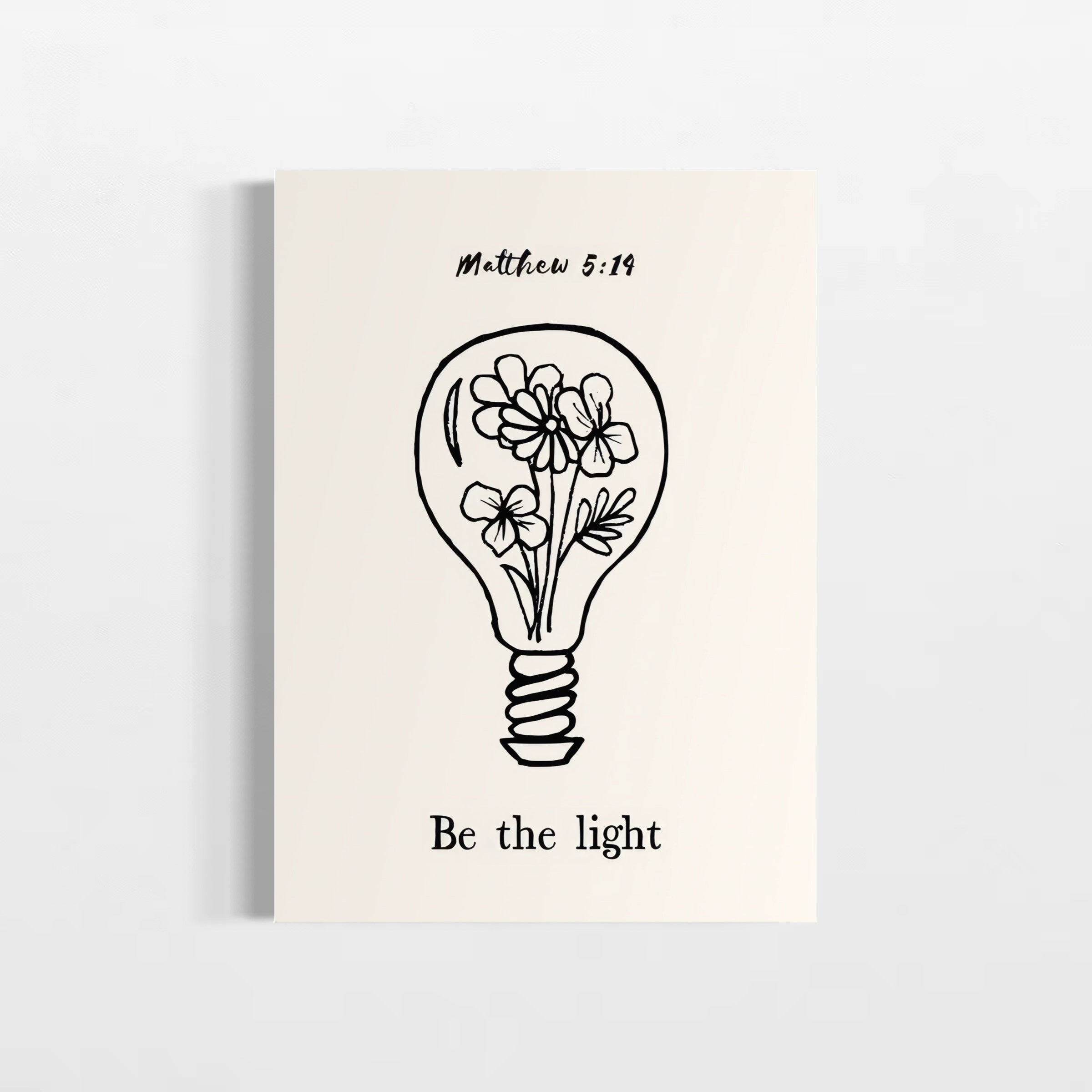 A simple line drawing of a light bulb with flowers inside, accompanied by the text "Be the light" and the Bible verse "Matthew 5:19".