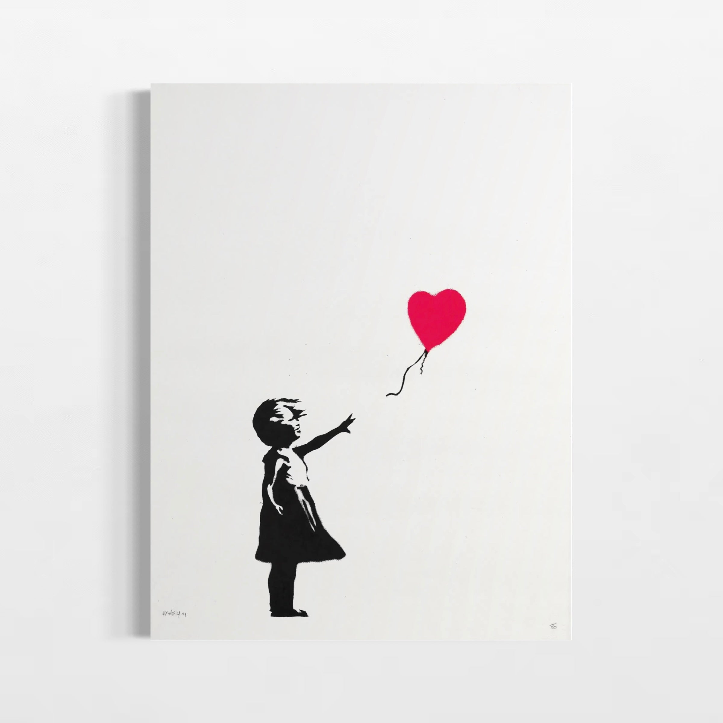 A black and white silhouette of a young girl holding a red heart-shaped balloon.