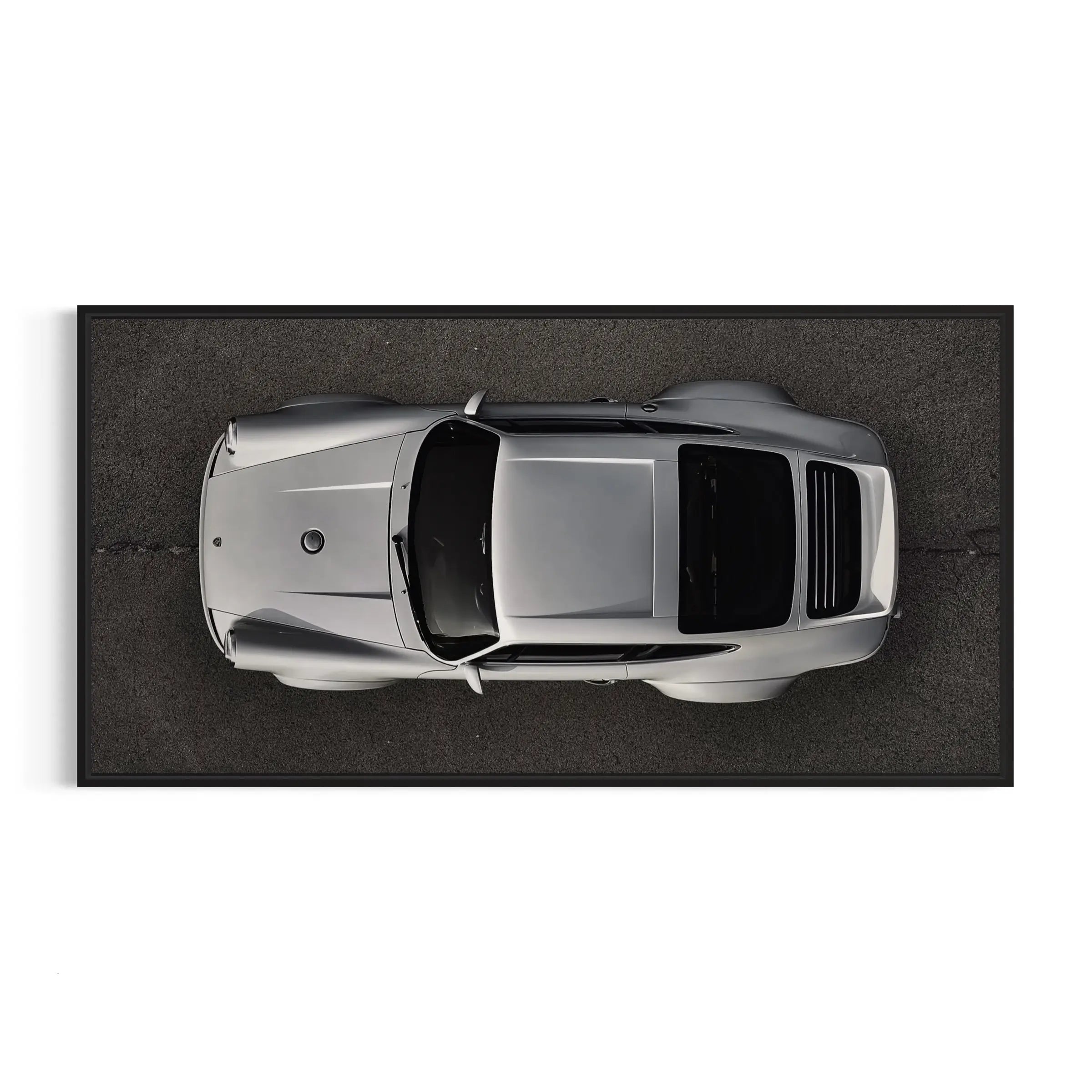 an overhead view of a silver sports car