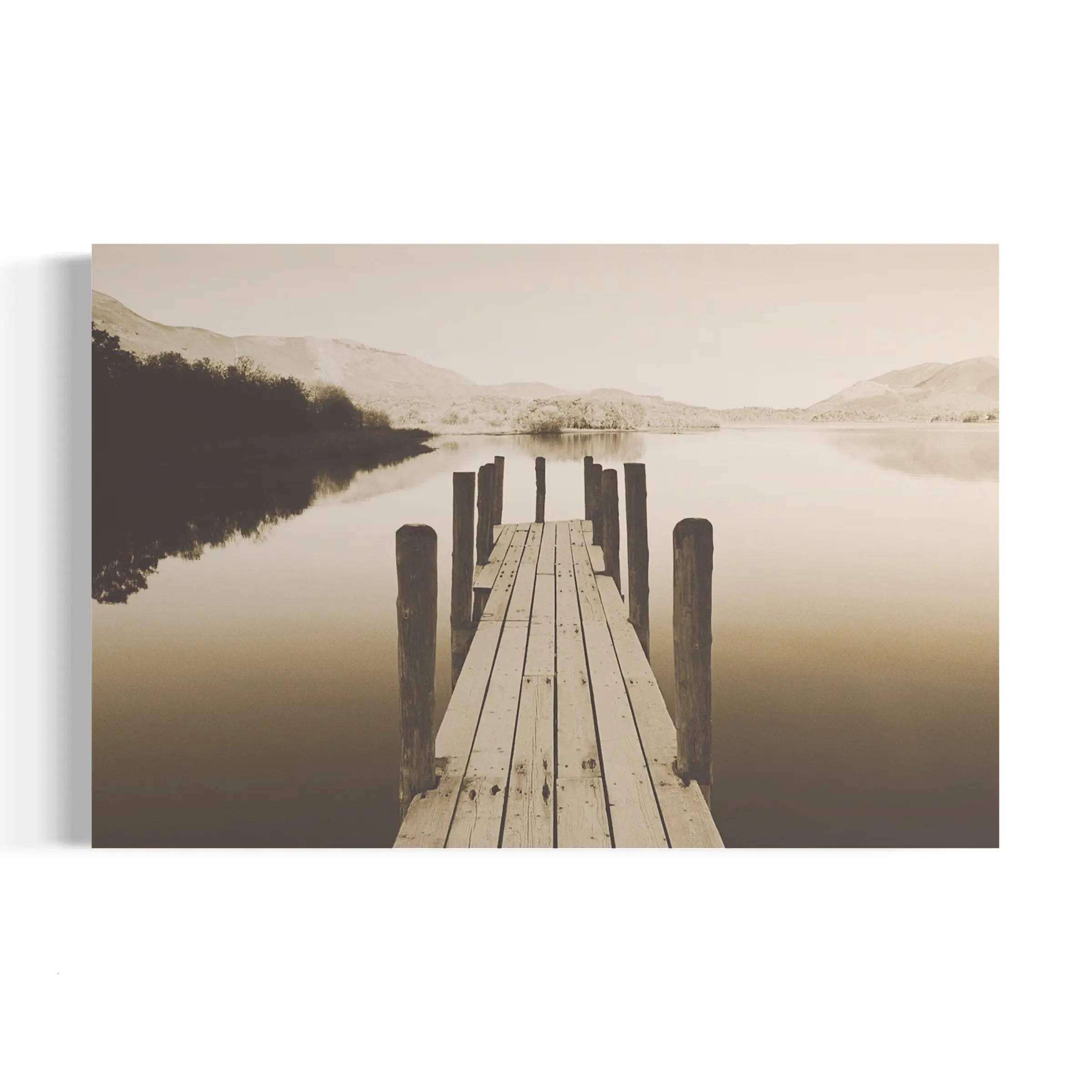 a wooden dock sitting on top of a lake