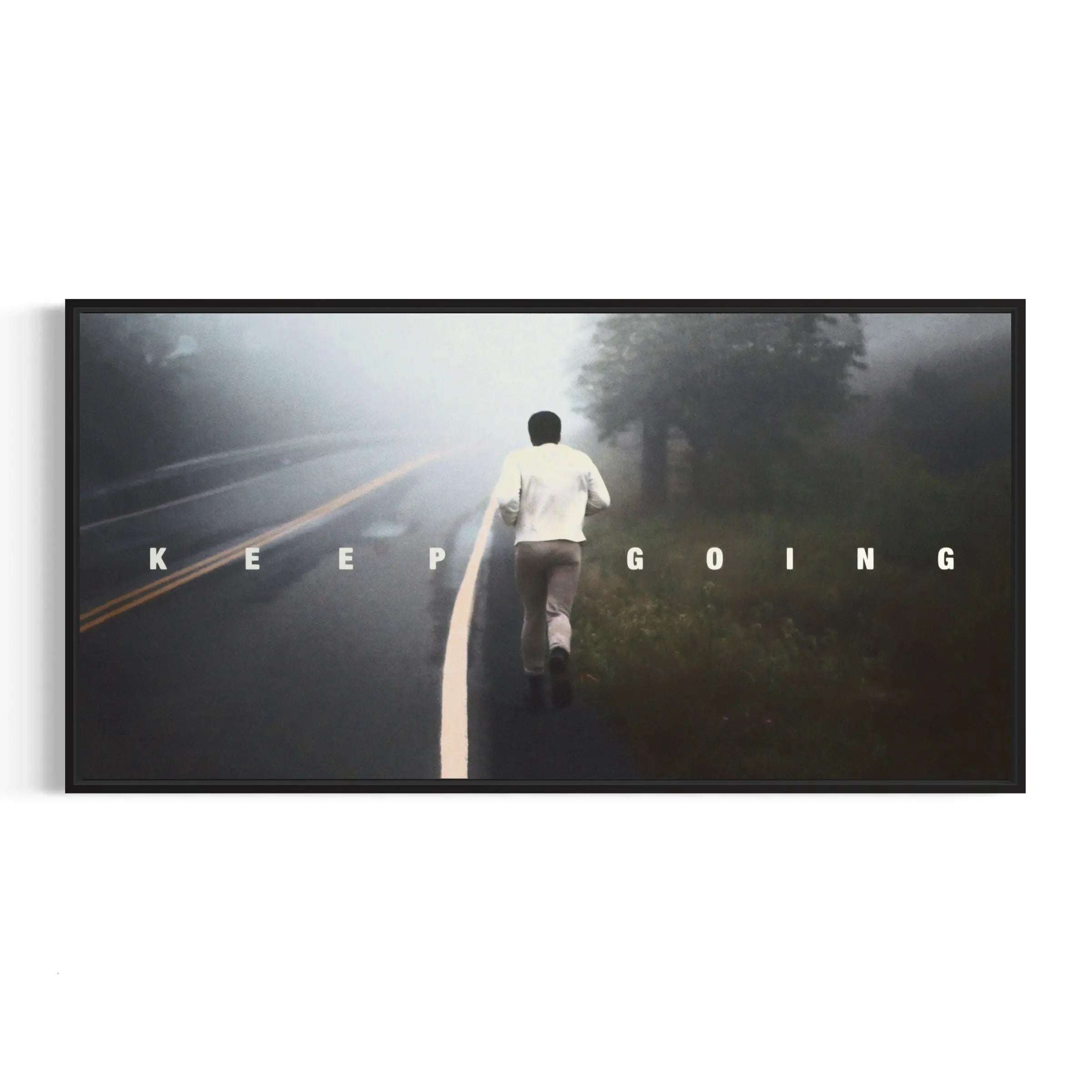 a man walking down a road in the fog