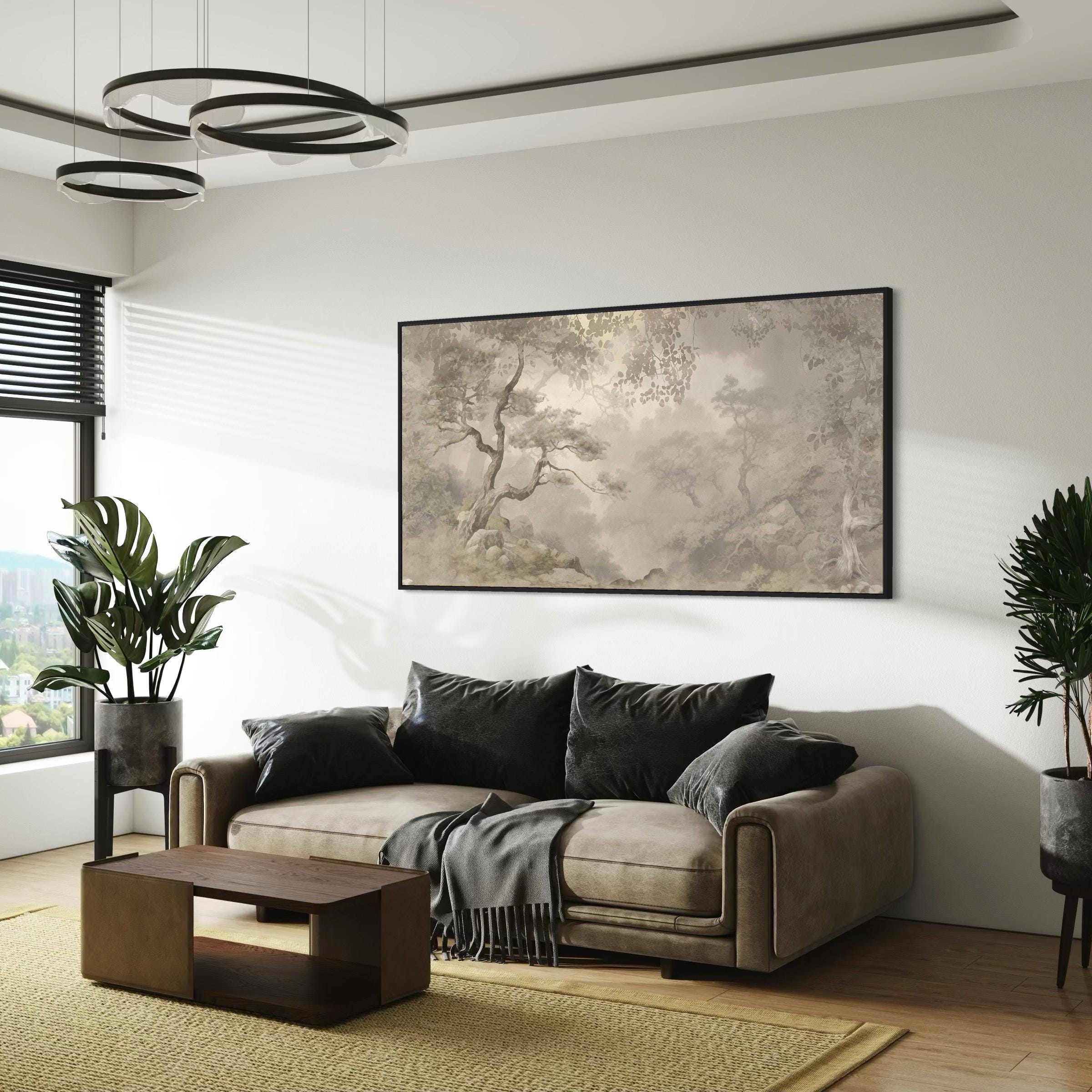 May include: A living room scene featuring a beige sofa with black pillows and a gray throw blanket. A dark wood coffee table sits on a yellow rug. A large framed landscape painting hangs above the sofa, and a potted plant is on the right.