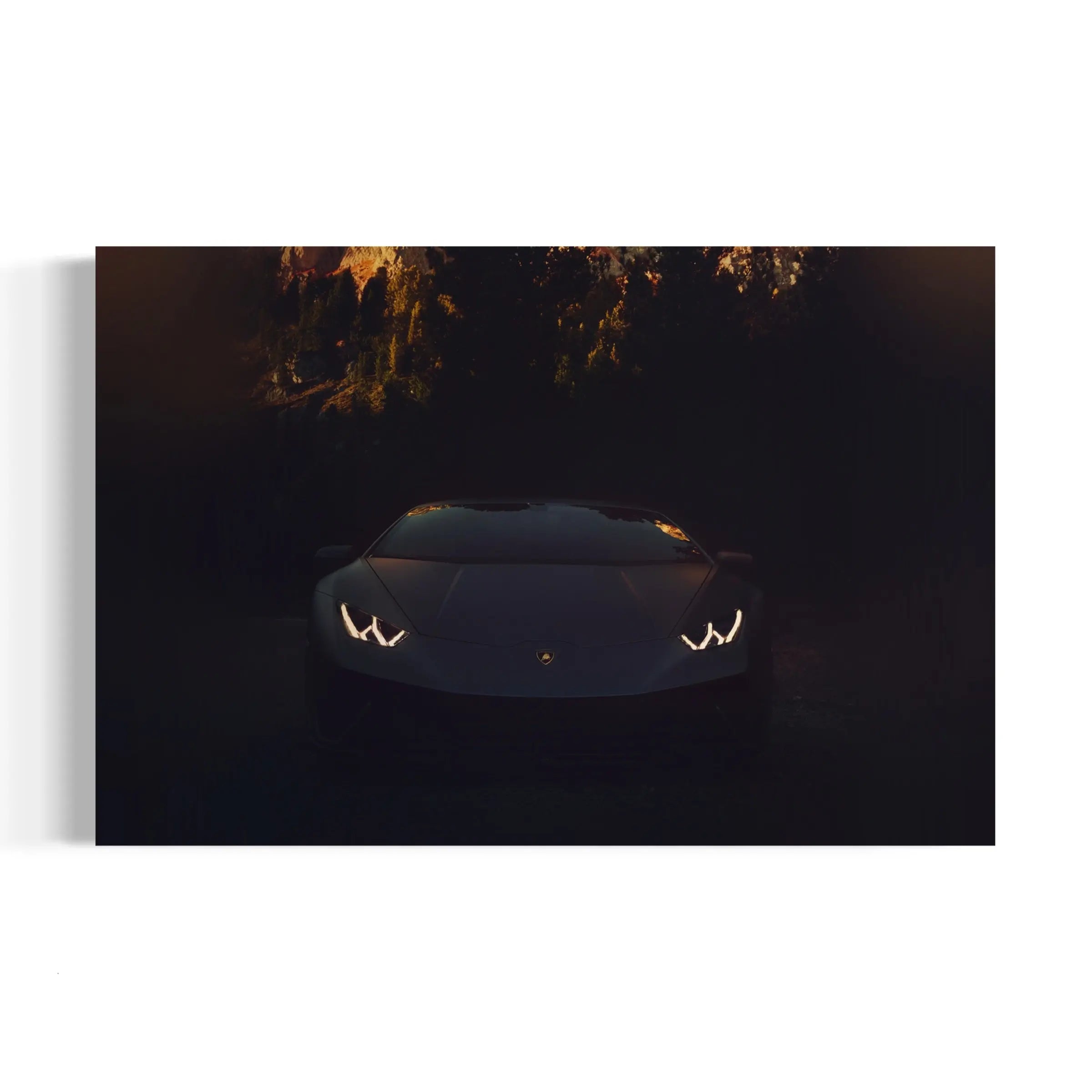 a white sports car is shown in the dark