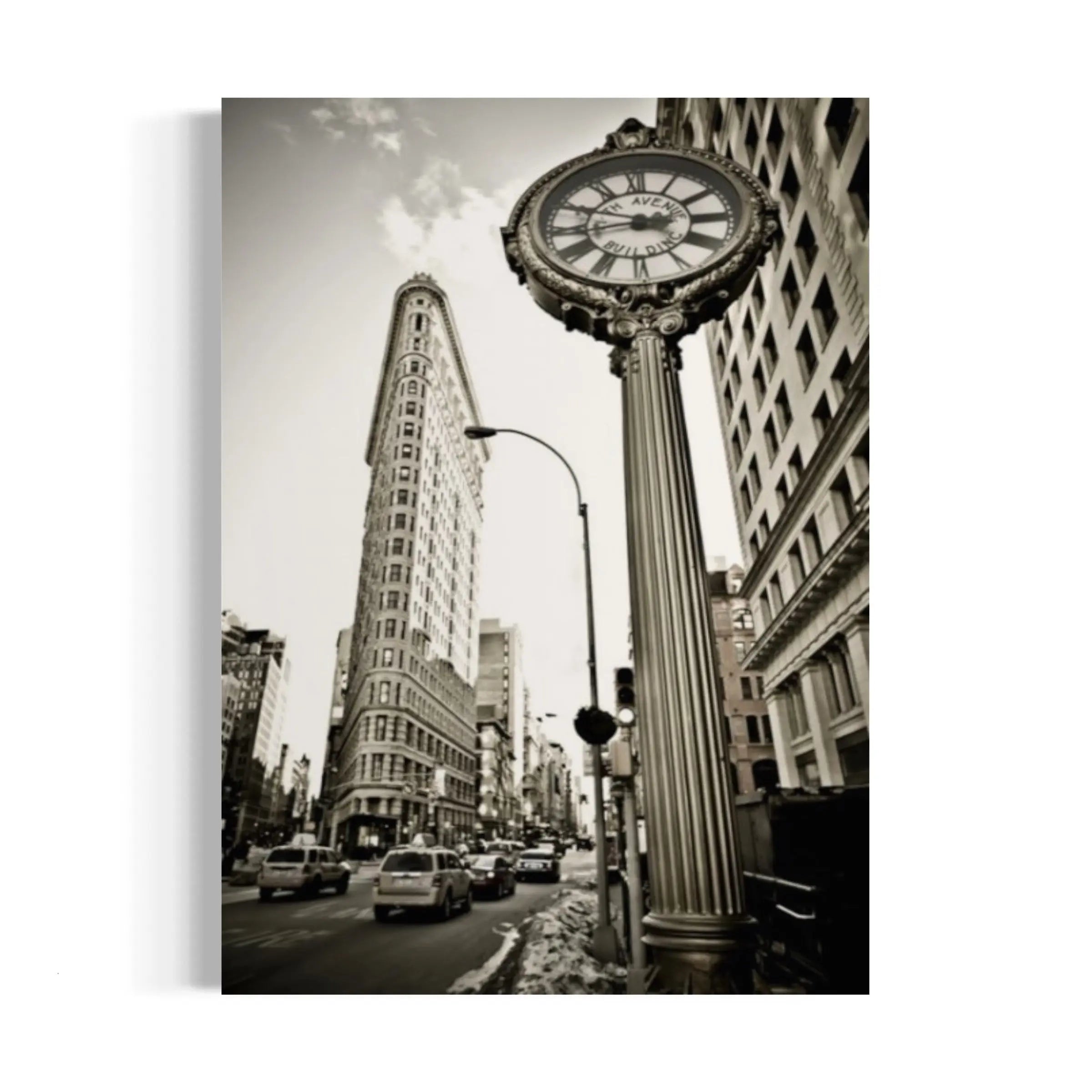 a black and white photo of a clock on a pole