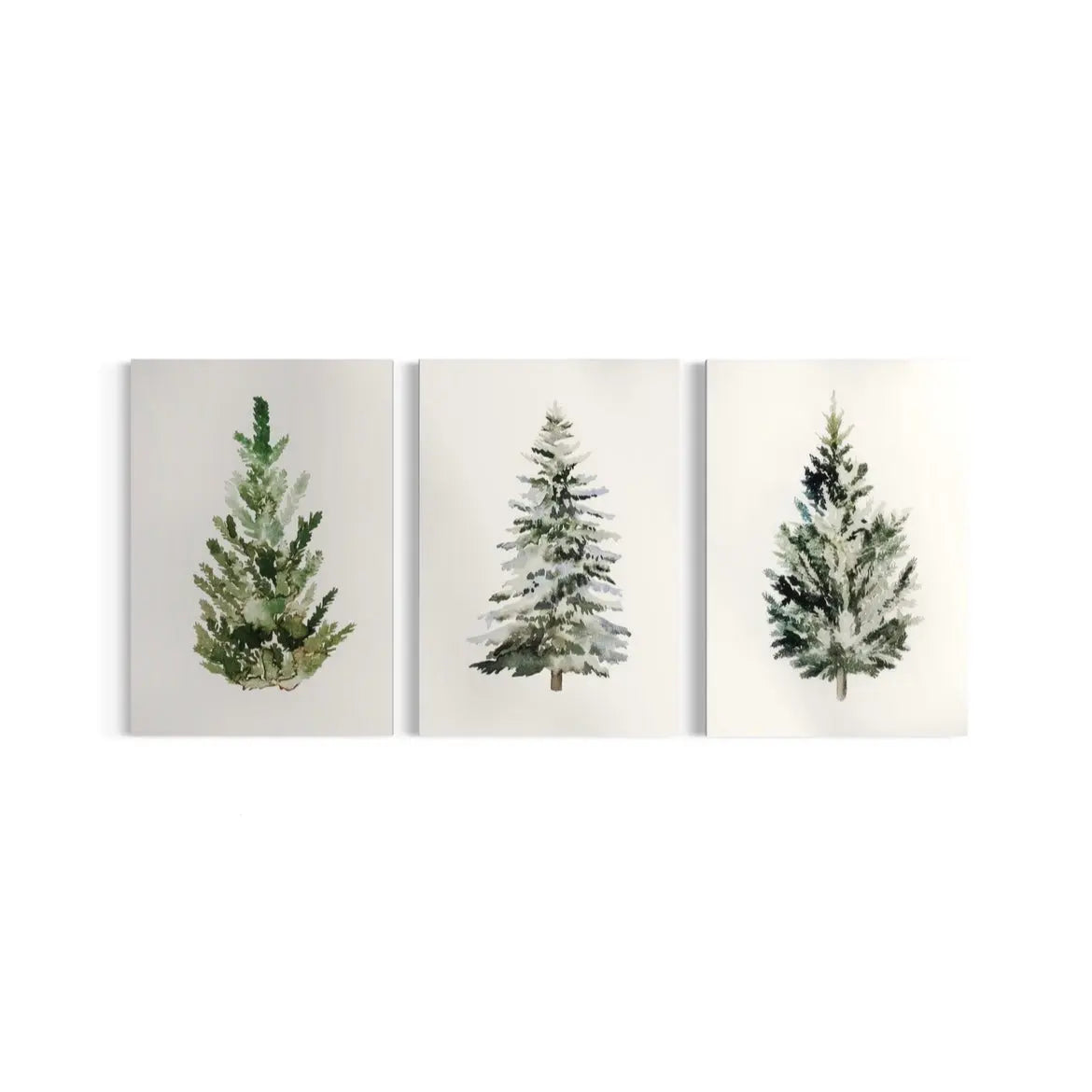 three paintings of trees on a white wall